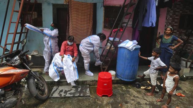 Health workers suit up before screening people for COVID-19 symptoms in Dharavi, on August 11. On August 10, Maharashtra recorded 9,181 new Covid-19 cases, as the state’s tally rose to 524,513, including 147,735 active cases. This came on the back of the highest single-day recovery tally of 13,348 Covid-19 patients a day prior on August 9. (Rafiq Maqbool / AP)