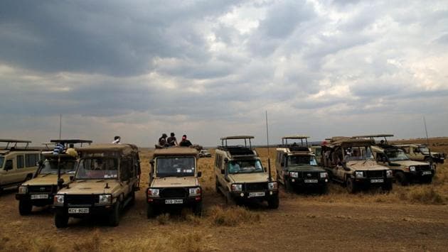 Visitors gather in Maasai Mara game reserve on August 9. This weekend, thousands of mostly Kenyan visitors travelled to the park to witness the migration. There were just few foreigners as Kenya had shut down international flights in March and only resumed them on August 1 due t the COVID-19 pandemic. (Thomas Mukoya / REUTERS)