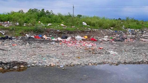 Solid waste dumped near a river bank in Dehradun.(HT File Photo)