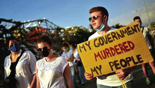 People take part in a vigil for the victims in Beirut, Lebanon.