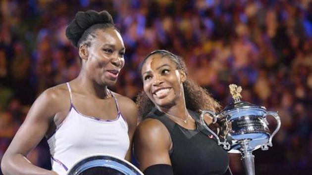Serena Williams (R) and Venus Williams of the United States attend an award ceremony following their Australian Open women's singles final in Melbourne on Jan. 28, 2017(Kyodo News Stills via Getty Imag)