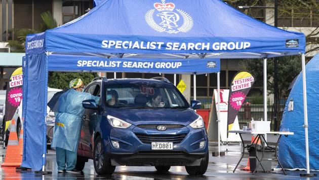 Medical staff tests residents at a pop up Covid-19 testing centre in Auckland on August 12. Prime Minister Ardern announced that more than 200 people with connections to those who tested positive were contacted on August 12 itself, “Our plan of mass testing, rapid contact tracing and, of course, our restrictions to stop the chain of transmission has been in full swing in Auckland today,” Ardern said in a public statement. (Greg Bowker / New Zealand Herald via AP) 