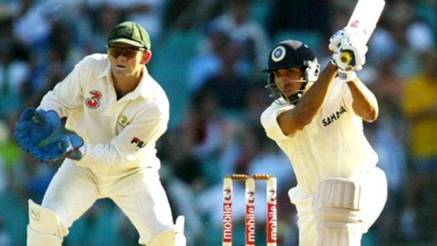 VVS Laxman (L) drives as Australian wicketkeeper Adam Gilchrist (L) looks on, on the first day of the fourth Test Match against India in Sydney 02 January 2004.(AFP)