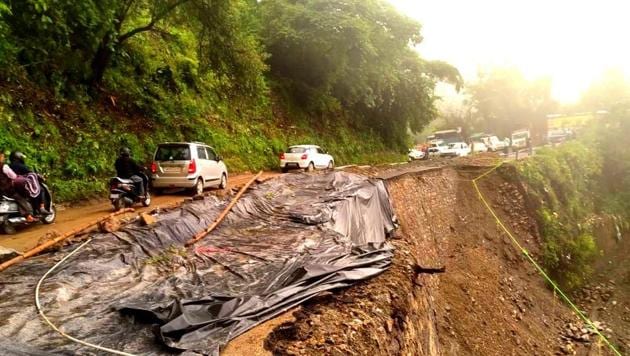 A portion of the Mussoorie- Dehradun road has been damaged due to a landslide following heavy rainfall in Uttarakhand.(HT Photo)