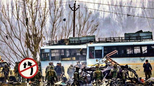 Security personnel carry out rescue and relief work at the site of a suicide bomb attack at Lathepora Awantipora in Pulwama district of south Kashmir on February 14, 2019.