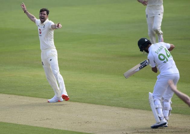 England's James Anderson, left, celebrates the dismissal of Pakistan's Shan Masood, right, during the first day of the second cricket Test match between England and Pakistan, at the Ageas Bowl in Southampton, England, Thursday, Aug. 13, 2020. (Stu Forster/Pool via AP) (AP)