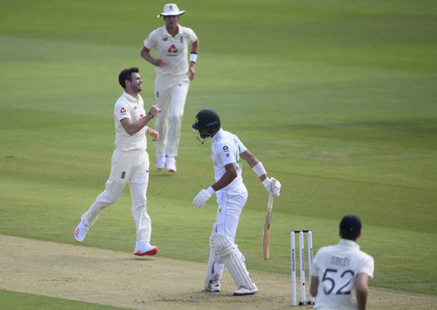 England's James Anderson, left, celebrates the dismissal of Pakistan's Shan Masood, second right, during the first day of the second cricket Test match between England and Pakistan, at the Ageas Bowl in Southampton, England, Thursday, Aug. 13, 2020. (Stu Forster/Pool via AP) (AP)