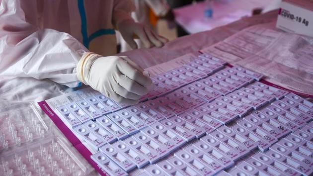 A health worker tests for Covid-19 infection at Mehrauli in New Delhi on August 10. India recorded 942 fresh fatalities due to Covid-19 on August 12, which pushed the death toll to 47,033, HT reported. (Amal KS / HT Photo)