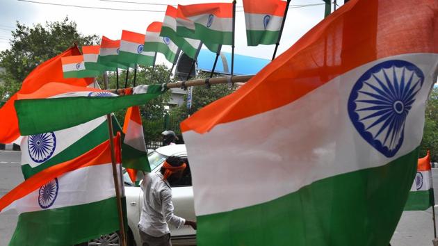 New Delhi, India - Aug. 12, 2020: A vendor selling the Indian tricolour ahead of Independence Day celebrations, near Akshardham Temple, in New Delhi, India.(Raj K Raj/HT PHOTO)