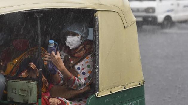 Commuters out in the rain near Chirag Delhi in New Delhi on August 12. After excess rainfall in July, monsoon precipitation has remained subdued in Delhi in August so far but the shortage reduced to 14 per cent by August 13 morning, PTI reported. (Sanjeev Verma / HT Photo) 