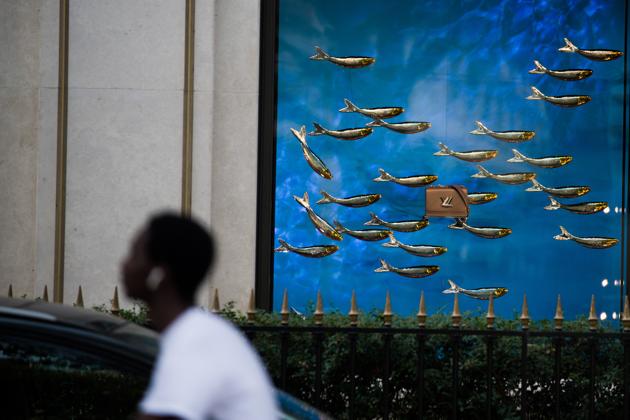 A luxury handbag sits in the window display of the Louis Vuitton luxury goods store, operated by LVMH Moet Hennessy Louis Vuitton SE, on Avenue Montaigne in Paris, France, on Wednesday, Aug. 12, 2020. (Bloomberg)