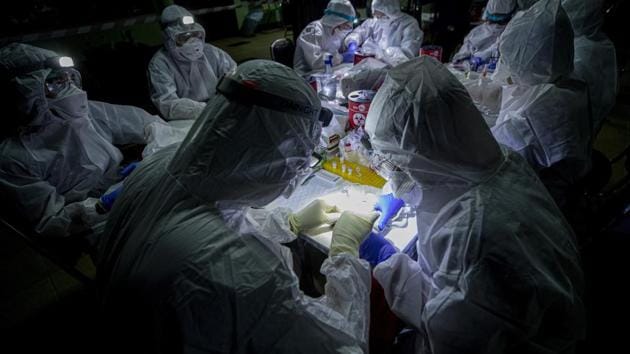 The team from the Thai Red Cross Emerging Infectious Diseases-Health Science Center took saliva, blood and stool samples from the bats before releasing them. They worked over two days, taking samples not only from horseshoe bats but also from other bat species they caught in order to better understand pathogens carried by the animals. (Sakchai Lalit / AP) The team from the Thai Red Cross Emerging Infectious Diseases-Health Science Center took saliva, blood and stool samples from the bats before releasing them. They worked over two days, taking samples not only from horseshoe bats but also from other bat species they caught in order to better understand pathogens carried by the animals. (Sakchai Lalit / AP)
