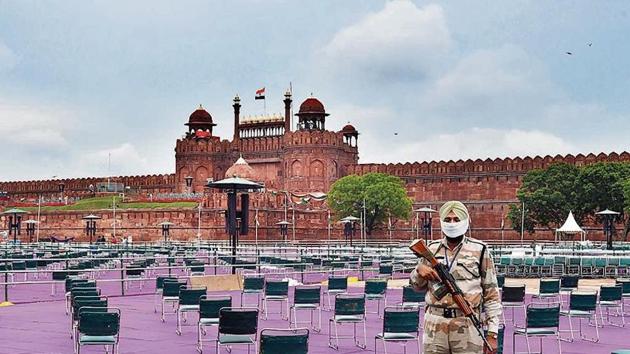 A security person stands guard at Red Fort, ahead of Independence Day.