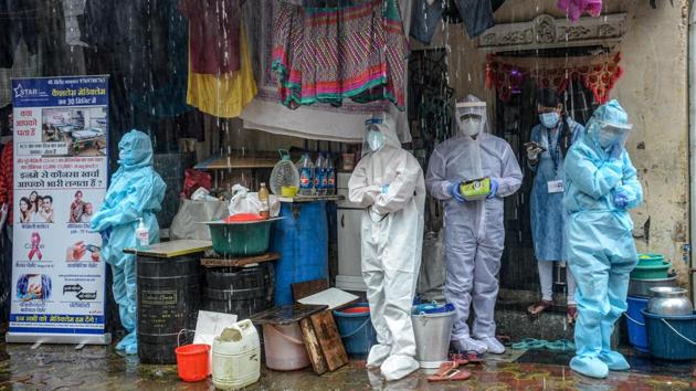 Health workers wearing Personal Protective Equipment (PPE) suits take shelter while conducting a COVID-19 coronavirus screening under heavy rain in Mumbai on August 12. Maharashtra continues to be the worst-hit state in the country, followed by Tamil Nadu and Andhra Pradesh. Delhi on August 14 crossed the 1.5 lakh case mark. (Indranil Mukherjee / AFP) Health workers wearing Personal Protective Equipment (PPE) suits take shelter while conducting a COVID-19 coronavirus screening under heavy rain in Mumbai on August 12. Maharashtra continues to be the worst-hit state in the country, followed by Tamil Nadu and Andhra Pradesh. Delhi on August 14 crossed the 1.5 lakh case mark. (Indranil Mukherjee / AFP)
