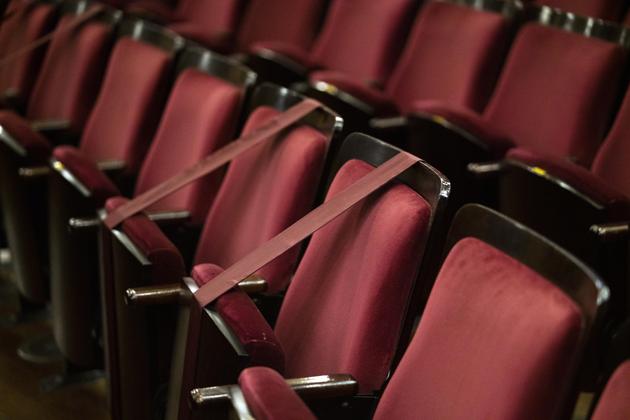 Blocked seats are seen before a concert amid the new coronavirus pandemic prior a concert by the Montevideo Symphonic Band at the Solis theatre in Montevideo, Uruguay, Thursday, Aug. 13, 2020. Five months after all the live arts shows were canceled, the Solis theatre reopen today with a live performance. (AP Photo/Matilde Campodonico) (AP)