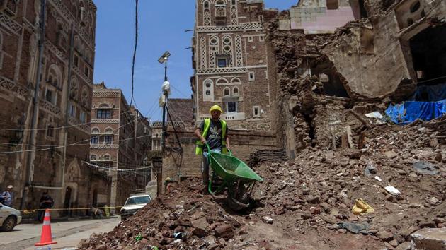 A labourer at work at a rubbled UNESCO-listed building following heavy rains in Sanaa on August 12. Doaa al-Wassiei called for more coordination between government and civil society groups involved in conservation. The work of those involved in protecting the nation’s heritage was being hampered by dysfunction and a lack of political will. (Mohammed Huwais / AFP)
