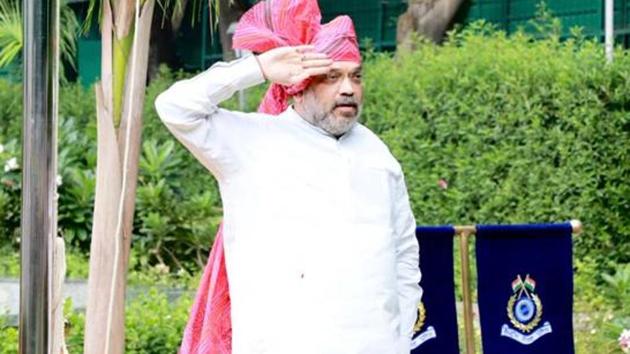 Home minister Amit Shah hoisted the national flag at his residence in New Delhi on the 74th Independence Day(Courtesy-PIB Delhi)