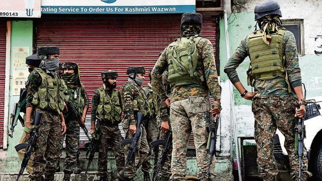 Security personnel inspect a spot after a terrorist attack in Nowgam on Friday. Security personnel inspect a spot after a terrorist attack in Nowgam on Friday.