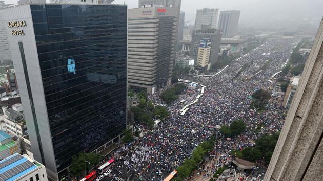 An aerial view of protesters marching during the anti-government protest in Seoul on August 15. Some marchers came from a church in northern Seoul that was shut down after it was linked to dozens of Covid-19 infections. (AP / PTI)