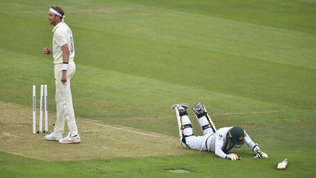 Pakistan's Mohammad Abbas, right, lies on the ground after successfully running into the crease to survive a run-out attempt by England's Stuart Broad, left, during the second day of the second cricket Test match between England and Pakistan, at the Ageas Bowl in Southampton. (AP)