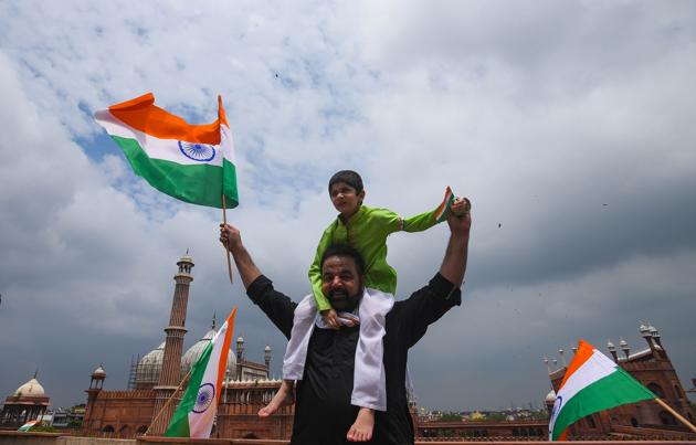 New Delhi, India - Aug. 14, 2020: People seen celebrating with the Indian tri-colour on the eve of 74th Independence Day, near Jama Masjid, in New Delhi, India, on Friday, August 14, 2020. (Amal KS/HT PHOTO)