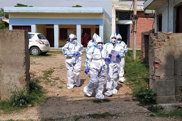 Health workers are seen in PPE suits in Panchkula, district of Haryana in this file photo. India has seen 830,204 Covid-19 cases since the beginning of this month and has been reporting over 60,000 cases every day since August 7.(Sant Arora/HT Photo)