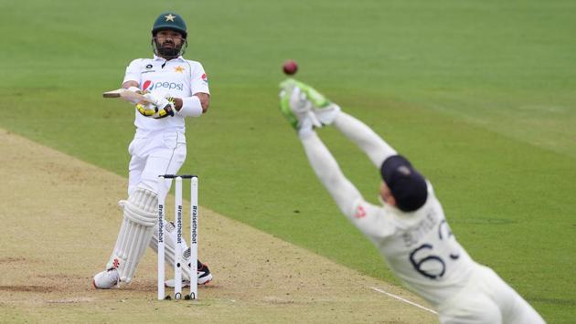 England's Jos Buttler dives as he attempts to make a catch to dismiss Pakistan's Mohammad Rizwan off the bowling of Stuart Broad. (REUTERS)