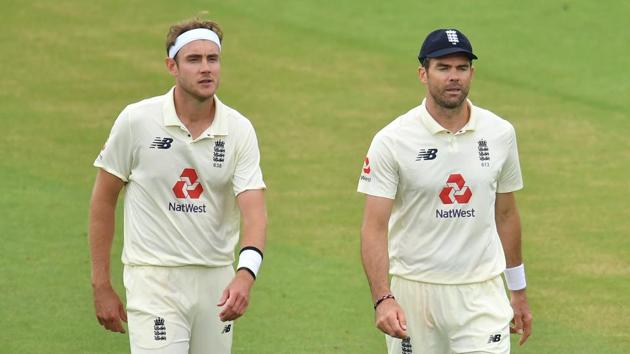 England's Stuart Broad and James Anderson walk off as play is delayed due to bad light. (REUTERS)