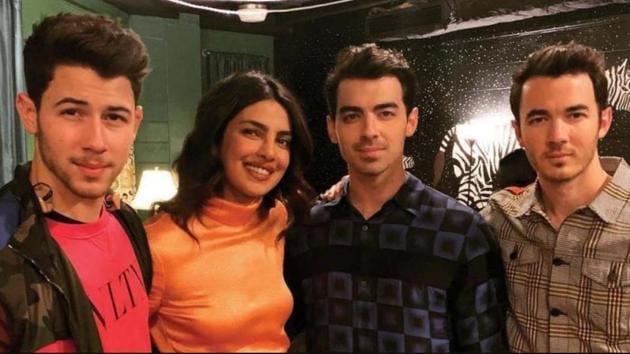 Priyanka Chopra poses with the Jonas Brothers.