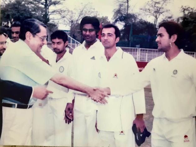 A young MS Dhoni being introduced to the then adviser. UT Chandigarh, Lalit Sharma, during the semi final of the Ranji Trophy Plate division against Haryana in March 2005