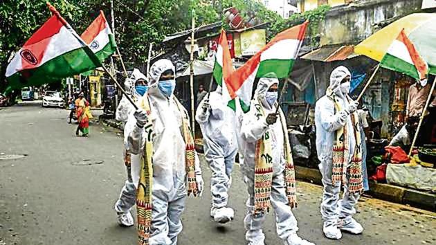 Covid warriors in PPE gear participate in Independence Day celebrations in Kolkata.