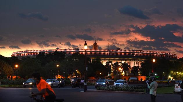 Clouds hover over Parliament House during sunset in New Delhi.(Arvind Yadav/HT PHOTO)