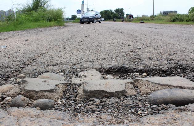 A view of the damaged portion of the road leading from Sector 76 to 80 in Mohali. (Gurminder Singh/HT) A view of the damaged portion of the road leading from Sector 76 to 80 in Mohali. (Gurminder Singh/HT)