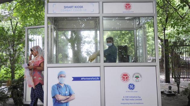 A woman exits a kiosk after giving a swab sample for coronavirus testing in Noida on August 14. As of August 15, India recorded a cumulative 2,587,872 cases and 50,079 deaths, according to HT’s tally. The US has seen 171,999 deaths from over 5.4 million cases, (CFR of 3.1%) and Brazil 106,608 fatalities from over 3.2 million infections (CFR of 3.2%) until now. (Sunil Ghosh / HT Photo)