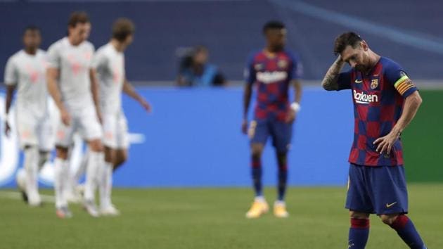 Barcelona's Lionel Messi holds his head during the Champions League quarterfinal match between FC Barcelona and Bayern Munich at the Luz stadium in Lisbon, Portugal, Friday, Aug. 14, 2020. Gerard Piqué says Barcelona "hit rock bottom" in an 8-2 humiliation from Bayern Munich in the Champions League quarterfinals. It's 74 years since Barcelona conceded eight goals in a game. (AP Photo/Manu Fernandez/Pool)(AP)