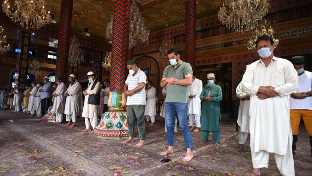 People stand distantly as they pray inside Masjid Dastgeer Sahib, in Srinagar, Jammu and Kashmir, India, on Sunday, August 16, 2020. The religious places in Kashmir valley reopened nearly five months after they were closed as a precautionary measure to contain the spread of Covid-19. (Photo by Waseem Andrabi/ Hindustan Times)