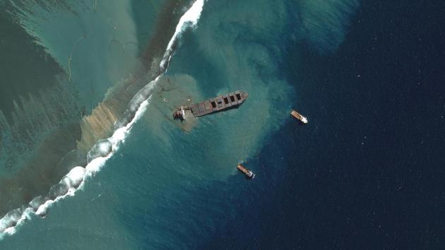 A view shows Japanese bulk carrier ship MV Wakashio as it begins to break apart, after it ran aground on a reef in Mauritius in July.(Maxar Technologies/Reuters Photo)