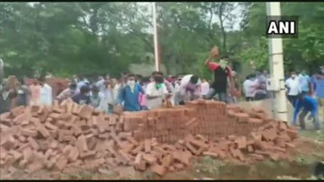 Locals in Bolpur in Bengal’s Birbhum district vandalised construction material stocked by authorities to build a wall around the ground of the Visva Bharati university where an annual fair is held.(ANI)