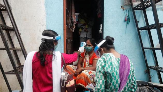 Community health volunteers check the temperature of a woman during a check up campaign for the coronavirus disease, at a slum in Mumbai on August 16. (Reuters Photo) Community health volunteers check the temperature of a woman during a check up campaign for the coronavirus disease, at a slum in Mumbai on August 16. (Reuters Photo)