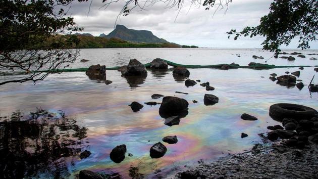Iridescence on the water at the beach in Petit Bel Air, due to the oil leaked from vessel MV Wakashio on August 15. The bulk carrier MV Wakashio had run aground on a coral reef off the southeastern coast of Mauritius on July 25 and began oozing oil more than a week later, threatening a protected marine park boasting mangrove forests and endangered species. (Fabien Dubessay / AFP)