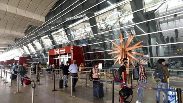 Passengers queue to get their documents verified before entering the IGI Airport amid the lockdown in New Delhi on May 30, 2020.(Sanjeev Verma/HT Photo)