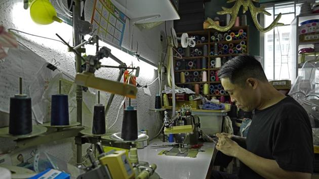 Edmond Kok, a Hong Kong theater costume designer and actor, is making a face mask at his studio in Hong Kong. (AP Photo/Vincent Yu) Edmond Kok, a Hong Kong theater costume designer and actor, is making a face mask at his studio in Hong Kong. (AP Photo/Vincent Yu)