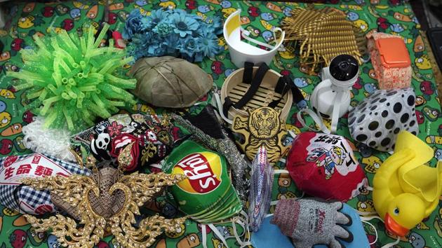 Face masks are seen on the table in studio by Edmond Kok, a Hong Kong theater costume designer and actor in Hong Kong Thursday, Aug. 6, 2020. (AP Photo/Vincent Yu) Face masks are seen on the table in studio by Edmond Kok, a Hong Kong theater costume designer and actor in Hong Kong Thursday, Aug. 6, 2020. (AP Photo/Vincent Yu)