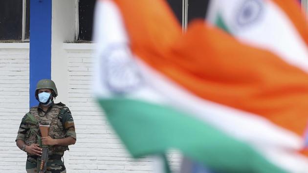 An Indian security officer stands guard during a graduation parade at the Air Force Academy in Dundigal, on the outskirts of Hyderabad, India.(AP) An Indian security officer stands guard during a graduation parade at the Air Force Academy in Dundigal, on the outskirts of Hyderabad, India.(AP)