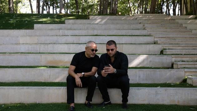 Lebanese fashion designer Elie Saab and his son, the brand's director, Elie Saab Jr. are seen during an interview with Reuters, following a massive explosion at the Beirut port area, in Faqra, Lebanon, August 15, 2020.(REUTERS/Alkis Konstantinidis)