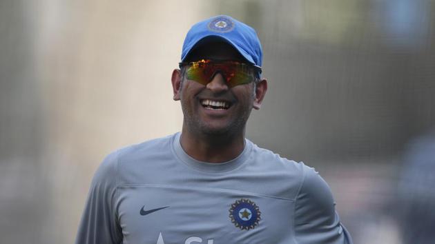 India's captain Mahendra Singh Dhoni laughs during a training session in the nets ahead of their ICC Twenty20 Cricket World Cup match against Australia in Dhaka, Bangladesh, Saturday, March 29, 2014. (AP Photo/Aijaz Rahi)(AP)