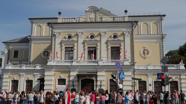 People gather outside the Yanka Kupala National Academic Theatre to support its General Director Pavel Latushka, who joined opposition protests against presidential election results and then was suspended from work, in Minsk, Belarus. (REUTERS) People gather outside the Yanka Kupala National Academic Theatre to support its General Director Pavel Latushka, who joined opposition protests against presidential election results and then was suspended from work, in Minsk, Belarus. (REUTERS)