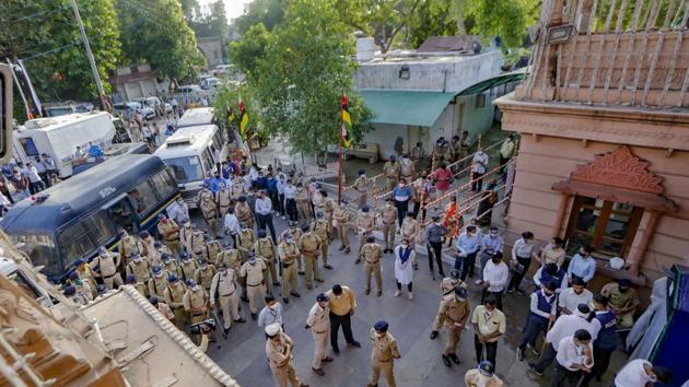 Heavy police force deployed at the main gate of the Jagannath temple as the annual Rath Yatra is being held inside the premises of temple due to the coronavirus outbreak, in Ahmedabad. (PTI) Heavy police force deployed at the main gate of the Jagannath temple as the annual Rath Yatra is being held inside the premises of temple due to the coronavirus outbreak, in Ahmedabad. (PTI)