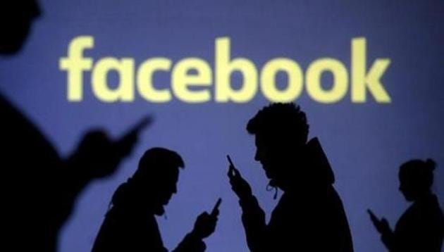 Silhouettes of mobile users are seen next to a screen projection of Facebook logo.(Reuters File Photo) Silhouettes of mobile users are seen next to a screen projection of Facebook logo.(Reuters File Photo)