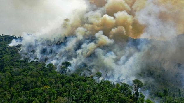 An aerial view of the Amazon rainforest reserve in the State of Para on August 16. The blazes that occur every year in the dry season, sent clouds of smokes billowing into the sky that could be seen and smelt from the capital of Rondonia state 24 miles (38 km) away, Reuters reported. (Carl De Souza / AFP)